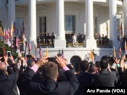 Pope Francis and President Barack Obama wave to onlookers before heading into a meeting in the Oval Office, Sept. 23, 2015.