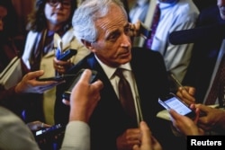 FILE- Senator Bob Corker speaks to reporters at the U.S. Capitol in Washington.