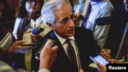 Senator Bob Corker speaks to reports at the US Capitol in Washington, April 21, 2015. 
