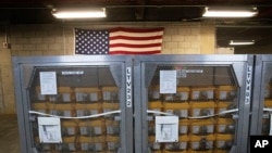 FILE - Cages of ventilators, part of a shipment of 400, arrive at the New York City Emergency Management Warehouse, March 24, 2020. 