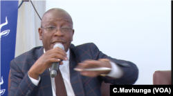 Ziyambi Ziyambi, Zimbabwe’s justice minister, speaks at a public meeting in Chinhoyi town, May 10, 2019.