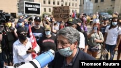 Kenosha Mayor John Antaramian speaks with protesters outside the Kenosha County Public Safety Building in Kenosha, Wisconsin, Aug. 24, 2020.
