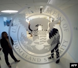 FILE - The Department of Homeland Security logo is seen at one of its annex facilities in Fairfax, Va.