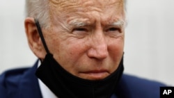 Democratic presidential candidate former Vice President Joe Biden listens as he meets with small-business owners, June 17, 2020, at Carlette's Hideaway, a soul food restaurant, in Yeadon, Pa. 