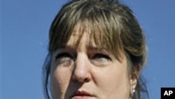 Nina Crossland, niece of Phyllis Macay, holds up a photo of Macay as she speaks to reporters outside of Magnolia Senior Center in South San Francisco, Calif., Feb 22, 2011
