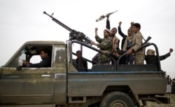 Houthi rebels fighters chant slogans following a gathering aimed at mobilizing more fighters in Sana’a, Yemen, Aug. 1, 2019.
