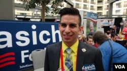 Julian Del Real-Calleros of Los Angeles is sticking with John Kasich, even though he's a distant third in the GOP race. "I’m supporting the guy who I believe is the perfect next president," he says. (M. O'Sullivan/VOA)