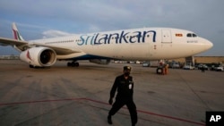 FILE - A SriLankan Airlines plane arrives in Colombo, Sri Lanka, Dec. 6, 2021. Sri Lanka's national airline on Feb. 27, 2024, blamed a rat for grounding a plane for three days, causing delays.