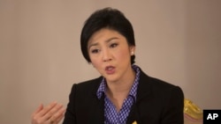 Thai Prime Minister Yingluck Shinawatra speaks during an interview with foreign media at Government House in Bangkok, Dec. 7, 2013.