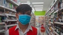 Phorn Phoan, 21, who works at Super Duper supermarket talks about the masks-only rules since the COVID-19 outbreak, Phnom Penh, Cambodia, March 28, 2020. (Khan Sokummono/VOA Khmer).