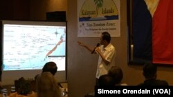 Mayor Eugenio Bito-onon of the Kalayaan Group of Islands, the Philippines-controlled outcroppings in the Spratly Islands, points out the Philippines' claims in the Spratlys during a fundraising dinner to gain support for a proposed "ecotourism zone" in th