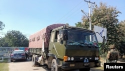 An army vehicle is parked outside the parliament members' residence after Myanmar army seized power in a coup, in Naypyitaw, Myanmar, Feb. 2, 2021. 