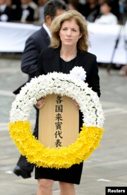 U.S. Ambassador to Japan Caroline Kennedy offers a wreath for victims of the 1945 atomic bombing in Nagasaki, in this Kyodo photo taken Aug. 9, 2014.