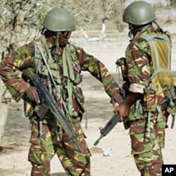 Kenyan soldiers talk as they prepare to advance near Liboi in Somalia (File)