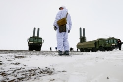 FILE - An officer stands near Bastion anti-ship missile systems on the Alexandra Land island near Nagurskoye, Russia, May 17, 2021.