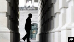 FILE - Senate Majority Leader Mitch McConnell of Ky. arrives at the U.S. Capitol in Washington. 