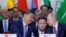 Russian President Vladimir Putin, right, and Chinese President Xi Jinping speak during a plenary session in the outreach/BRICS Plus format at the BRICS summit in Kazan, Russia, Oct. 24, 2024.
