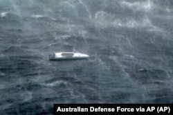 In this photo provided by the Australian Defense Force Lithuanian rower Aurimas Mockus' boat is photographed in heavy seas in the Coral Sea off the northeast coast of Australia, Saturday, March 1, 2025