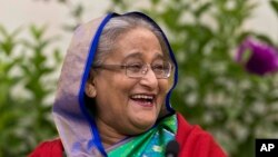 Bangladeshi Prime Minister Sheikh Hasina interacts with journalists in Dhaka, Bangladesh, Dec. 31, 2018. 
