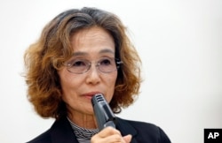 Junko Ishido, mother of Japanese hostage Kenji Goto held by Islamic State group, speaks during a press conference in Tokyo, Wednesday, Jan. 28, 2015.