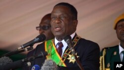 FILE - Zimbabwean President Emmerson Mnangagwa addresses people during a Heroes' Day holiday event to commemorate the lives of those who died in the southern African country's 1970s war against white minority rule, in Harare, Aug. 13, 2018.