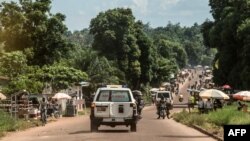 An ambulance carries the remains of an Ebola victim towards a burial site in Mbandaka on May 22, 2018, in the Democratic Republic of Congo.