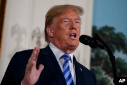 President Donald Trump delivers a statement on the Iran nuclear deal from the Diplomatic Reception Room of the White House, May 8, 2018, in Washington.