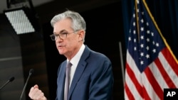FILE - Federal Reserve Chair Jerome Powell speaks during a news conference, March 3, 2020, in Washington.