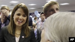 Delaware Republican Senate nominee Christine O'Donnell talks to supporters before the start of a campaign rally, Thursday, Oct. 28, 2010, in Dover, Del.