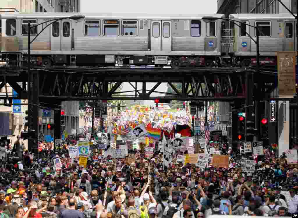 Demonstrators flow out of Grant Park in Chicago during this weekend's NATO summit Sunday, May 20, 2012 in Chicago.