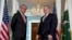 Secretary of State Mike Pompeo stands with Pakistani Foreign Minister Shah Mehmood Qureshi at the Department of State in Washington, Jan. 17, 2020.