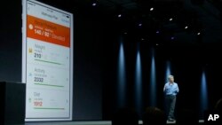 FILE - Apple senior vice president of Software Engineering Craig Federighi speaks about the Apple HealthKit app at the Apple Worldwide Developers Conference in San Francisco, June 2, 2014.