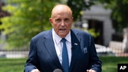 FILE - Rudy Giuliani, personal attorney for then-President Donald Trump, talks with reporters outside the White House, July 1, 2020, in Washington.