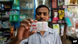 A chemist displays hydroxychloroquine tablets in Mumbai, India, May 19, 2020 after President Donald Trump’s declaration that he was taking the antimalarial drug of dubious effectiveness to help fend off the coronavirus.