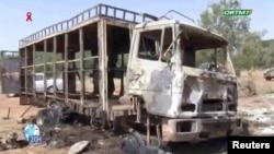 A burnt bus is seen following a gunmen attack near Bankass, Mali on Dec. 4, 2021 in this still image obtained from a video.