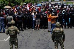 Mexican authorities stop a migrant caravan that had earlier crossed the Mexico-Guatemala border, near Metapa, Chiapas state, Mexico, June 5, 2019.