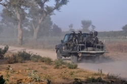 Members of the Cameroonian Rapid Intervention Force patrol, March 21, 2019, on the outskirt of Mosogo in the far north region of the country where Boko Haram jihadist have been active since 2013.