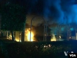 FILE - The U.S. Consulate in Benghazi, Libya burns during a September 2012 attack that killed the U.S. Ambassador and three others.
