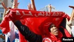 An anti-government protester rallies for the dissolution of the Islamist-led government in Sfax, 170 miles (270 km) southeast of Tunis, Tunisia, Sept. 26, 2013.