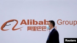 FILE - A logo of Alibaba Group is seen during the World Internet Conference (WIC) in Wuzhen, Zhejiang province, China, Nov. 23, 2020. 