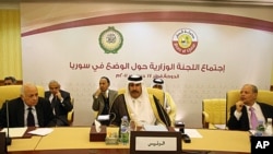 Arab League Secretary General, Nabil Elarabi, left, Qatari Prime Minister Sheikh Hamad bin Jassim bin Jabr al-Thani, center, and Ahmed bin Heli, the Arab League's assistant secretary-general for political affairs, during the group's meeting on Syria held 