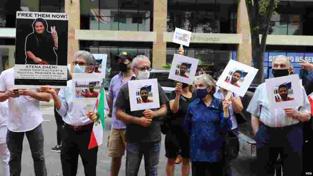  تجمع اعتراض به اعدام نوید افکاری مقابل دفتر حفاظت از منافع جمهوری اسلامی در واشنگتن - جمهوری اسلامی ایران به رغم درخواست‌های گسترده جهانی، این ورزشکار کشتی‌گیر را روز شنبه ۲۲ شهریور اعدام کرد. 