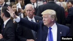 FILE - Republican U.S. presidential candidate Donald Trump waves to supporters at a Super Tuesday campaign rally in Louisville, Kentucky, March 1, 2016.