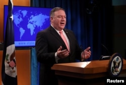 U.S. Secretary of State Mike Pompeo speaks to reporters during a news briefing at the State Department in Washington, Oct. 23, 2018.