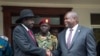 FILE - South Sudan President Salva Kiir, left, and First Vice President Riek Machar, right, shake hands after meetings in Juba, South Sudan, Oct. 20, 2019. Kiir appealed for calm after a U.N. helicopter was attacked and a crew member killed during a Friday rescue mission. 