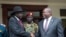 FILE - South Sudan President Salva Kiir, left, and First Vice President Riek Machar, right, shake hands after meetings in Juba, South Sudan, Oct. 20, 2019. Kiir appealed for calm after a U.N. helicopter was attacked and a crew member killed during a Friday rescue mission. 