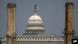 FILE- The Capitol dome is seen behind the Capitol Power Plant in Washington in a June 24, 2013, photo.