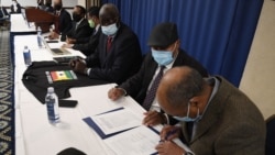 Representatives of nine factions opposed to Ethiopian Prime Minister Abiy Ahmed participate in a signing ceremony to form a new alliance called the "United Front of Ethiopian Federalist and Confederalist Forces" at the National Press Club in Washington, Nov. 5, 2021.