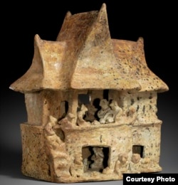 This two-story Nayarit house (100 B.C to A.D. 200) depicts a great feast. On the upper level, 16 figures, including pairs of men and women with their arms wrapped around one another, gather around vessels filled with food and beverages. (Credit: MOMA)