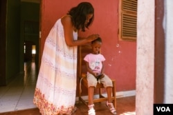 Adele dos Santos, pictured here in Bissau, Guinea Bissau, Nov. 22, 2018, is a fashion designer, mother, and member of the "Young Women Entrepreneurs” group in Bissau. She says societal pressures to take care of the household - and not spend too much time at work - make it harder for women business owners. (R. Shryock for VOA)